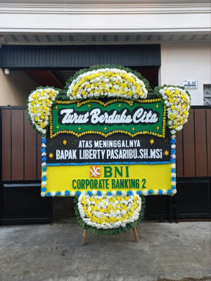 Papan Bunga Duka di Bika