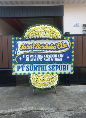 Papan Bunga Duka di Bika
