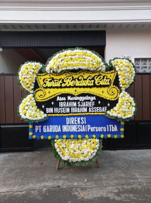 Papan Bunga Duka di Bika