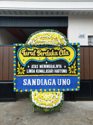 Papan Bunga Duka di Bika